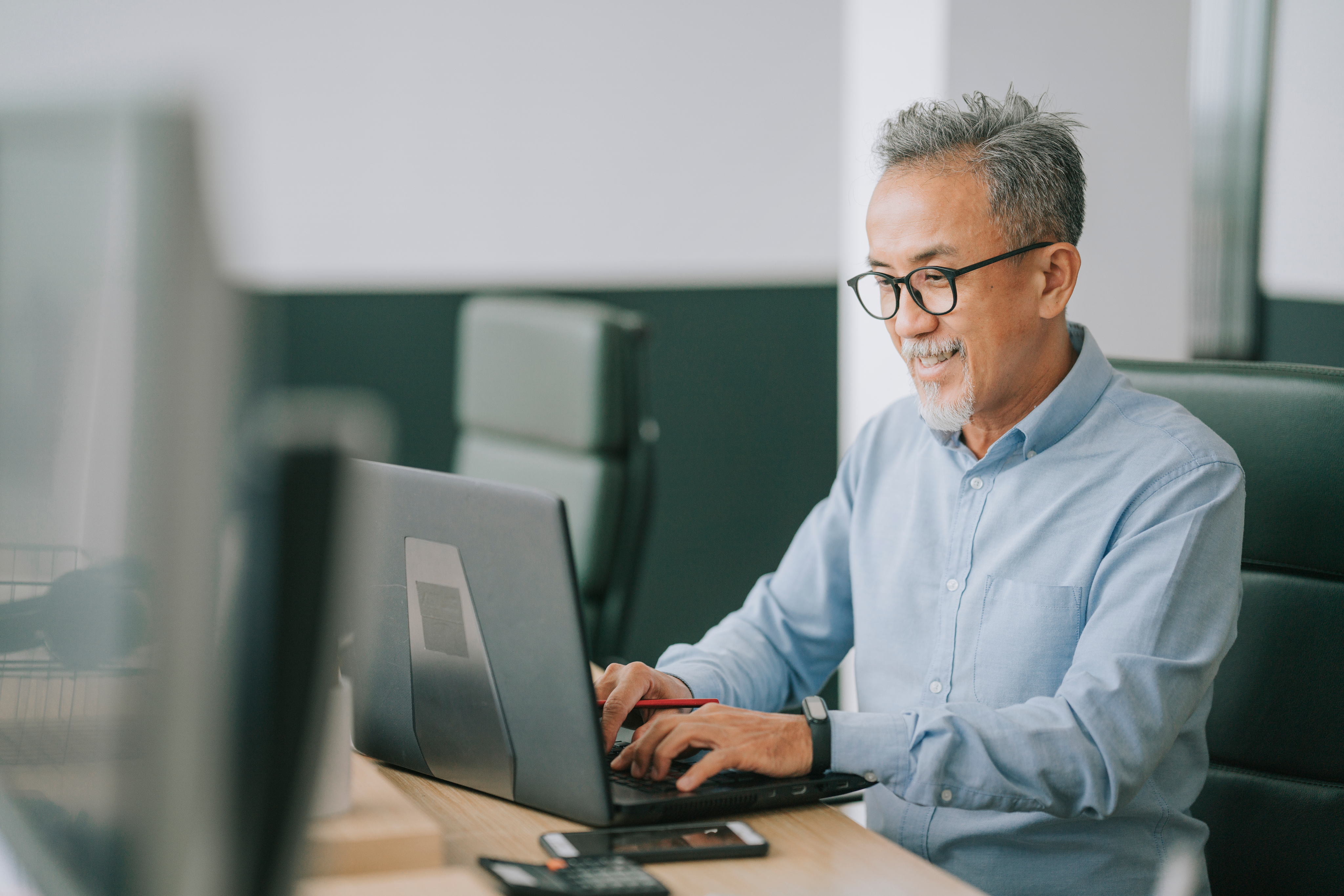 Dental professional using laptop for clinical documentation